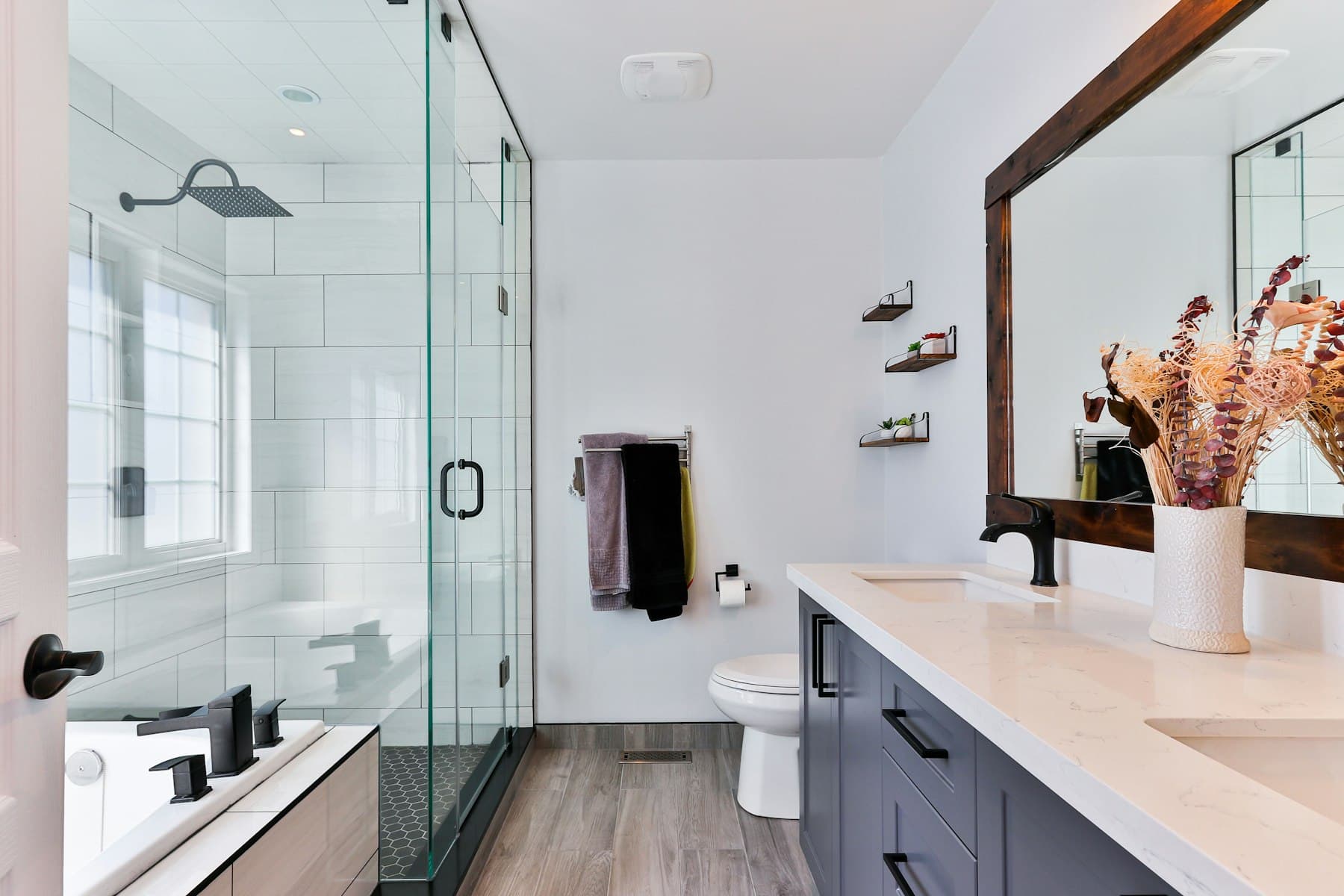 Stone vanity and mirror in the Gurugram bathroom